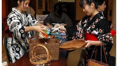 Japanese expatriates don their favourite kimonos last night at the Dubai Women's Association as part of a charity event for the victims of the Japanese earthquake and tsunami.