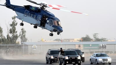 A helicopter hovers above SUVs as the security forces carry out a demonstration. Fayez Nureldine/AFP Photo