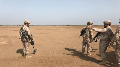 Members of the UAE armed forces search for landmines laid by Houthi rebels in Mokha, Yemen on March 6, 2018. Aziz El Yaakoubi / Reuters