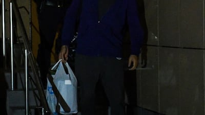 Russian opposition leader Alexei Navalny leaves a court surrounded by a police officer after being sentenced to 30 days in jail for repeatedly violating demonstration regulations, Moscow. AFP