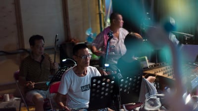 Chiu Chow opera musicians play during a performance. EPA