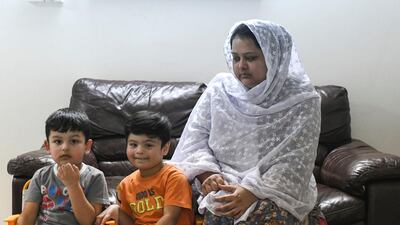 Mahjbeen Ahmed, Mr Ali's wife, with their two sons, Ariz, 3, and Abban, 4 at their home in Al Bahya. Khushnum Bhandari for The National