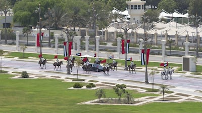 Members of the UAE Armed Forces Cavalry Division escort Mr Xi's motorcade towards the palace entrance. Crown Prince Court - Abu Dhabi