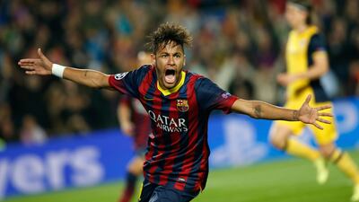 Barcelona's Neymar celebrates after scoring his side's goal during their Uefa Champions League quarter-final first leg against Atletico Madrid at the Camp Nou on April 1, 2014. Emilio Morenatti / AP Photo