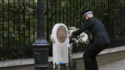 Metropolitan Police Commissioner Sir Mark Rowley lays flowers. PA