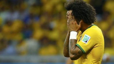 Marcelo of Brazil reacts after his team concedes a seventh goal to Germany in their 7-1 World Cup semi-final loss on Tuesday night. Kai Pfaffenbach / Reuters / July 8, 2014