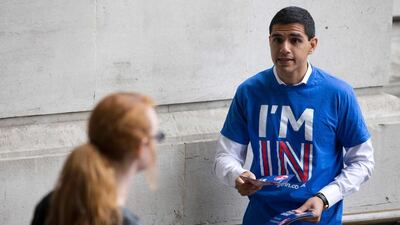 A campaigner hands out leaflets stating the official Remain case. Justin Tallis / AFP