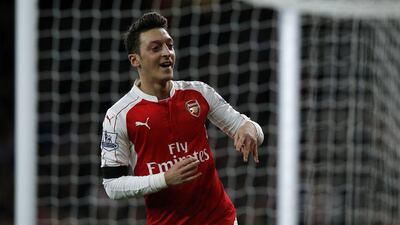 Arsenal’s Mesut Ozil celebrates after scoring on Monday night against Bournemouth in his team’s Premier League victory at the Emirates Stadium. Adrian Dennis / AFP