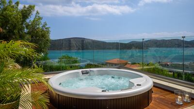 A jacuzzi sits on the terrace leading from one of the master bedrooms