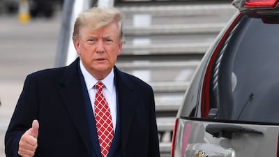 Donald Trump gives the media the thumbs up after disembarking from 'Trump Force One' at Aberdeen airport. AFP