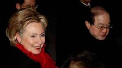 Hillary Clinton, the US Secretary of State, walks with Liu Jieyi, the Chinese assistant foreign minister, at the airport in Beijing.