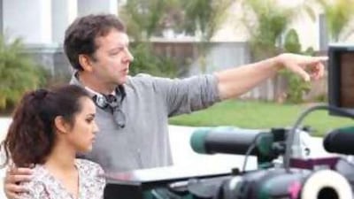 Director Alan Ball works with his lead actress Summer Bishil on the set of Towelhead .