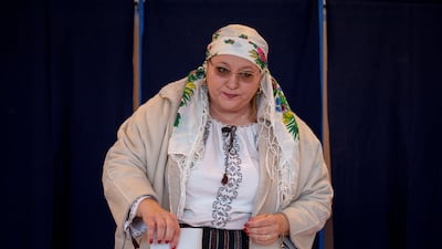 Diana Iovanovici-Sosoaca, the leader of the SOS Romania party and member of the European Parliament casts her vote in Bucharest. AP