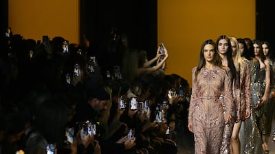 Brazilian model Alessandra Ambrosio presents a creation by Elie Saab for a Women Ready 2024/25 collection at Paris Fashion Week. AFP