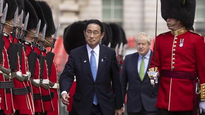 Prime Minister Boris Johnson welcomes Japanese Prime Minister Fumio Kishida with a Guard of Honour in Horse Guards Parade in London during his visit to the UK. PA