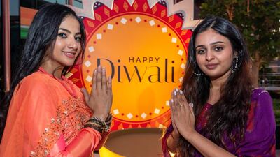 Visitors to the India pavilion prepare for the festival of lights. Victor Besa / The National