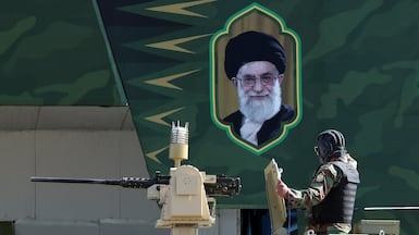 A tank passes an image of Iran's supreme leader Ayatollah Ali Khamenei, during the annual Army Day celebration in Tehran. EPA