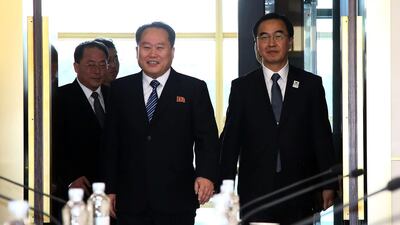 South Korean unification minister Cho Myoung-gyon (R) and head of North Korean delegation Ri Son Gwon (L) walk into a meeting room before their meeting at the Panmunjom in the Demilitarised Zone on January 9, 2018. Getty Images