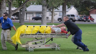 September 16, 2011: Medics wheel a man into Renown Medical Center after a plane crashed into the crowd at the Reno National Championship Air Races, injuring at least 75 spectators and leaving a horrific scene of bodies and wreckage. (AP Photo/The Reno Gaz???