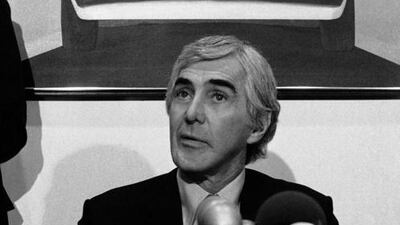 In this Feb 19, 1982 file photo, John Z DeLorean of the DeLorean Motor Car Co holds press conference at his Park Avenue office on the restructuring of his company. Behind is photo car bearing his name. In 2014, the widow of automaker John DeLorean sued a Texas company she said has been illegally using the DeLorean name for years. AP file