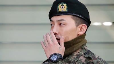Leader of South Korean K-pop boyband Big Bang G-Dragon leaves after being discharged from army in Yongin, South Korea, October 26, 2019. REUTERS/Heo Ran