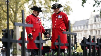 Chelsea pensioners at the Field of Remembrance at Westminster Abbey in London. PA
