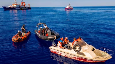 Three small rescue boats from the civil sea rescue ship Sea-Watch 4, left, and the Louise Michel, right, a rescue boat funded by the British artist Banksy, off the coast of Libya on August 22, 2020. AFP