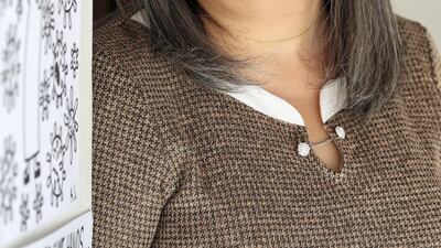 Art teacher Gulshan Kavarana supports two Emirati artists with special needs who have been given a space to work in a Tashkeel studio in the Al Fahidi area of Dubai. Chris Whiteoak / The National