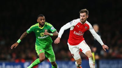 Aaron Ramsey of Arsenal and Yann M'Vila of Sunderland compete for the ball during their Premier League match at Emirates Stadiumon December 5, 2015 in London, England. (Photo by Paul Gilham/Getty Images)