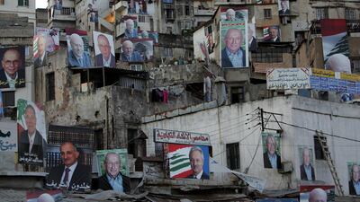 Election campaign posters covering buildings in a working-class neighbourhood in Tripoli in the 2009 election. Anwar Amro / AFP