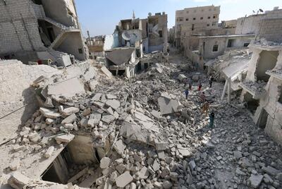 Destroyed buildings after an alleged Syrian government forces' barrel bomb attack in Aleppo. AFP Photo