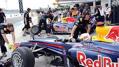The Red Bull-Renaults of Sebastian Vettel and Mark Webber in the pits during practice for the Japan Grand Prix.