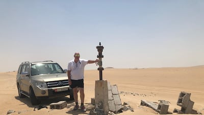 David Pryce back at the camp in 2018. The rudimentary buildings he lived in have been reclaimed by the desert. Courtesy David Pryce