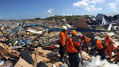 Rescuers searching for victims after a 7.7 magnitude earthquake and tsunami in Palu. EPA, HO