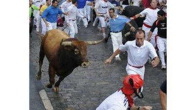 One runner was gored in the leg and three more needed hospital treatment after last July's running of the bulls in Pamplona. Vincent West / Reuters