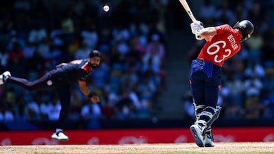 England's Jos Buttler hits a four on his way to making 83 off 38 balls against the USA. AFP