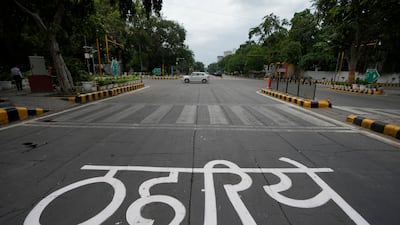 A sign in Hindi reads 'stop' at an intersection on a closed road leading to the venue of the G20 summit in New Delhi on September 9, 2023. AP Photo