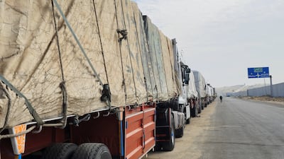 Lorries carrying aid wait on the Egyptian side of the Rafah border crossing, ready to enter Gaza, on Thursday. Reuters