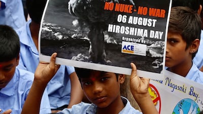 Indian schoolchildren hold placards to commemorate 'Hiroshima Day' at a school in Bangalore, India, 6 August 2026.