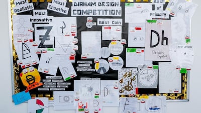 Students from Al Shohub School in Khalifa City A held a school-wide competition where they were charged with designing a symbol for the UAE’s currency. Victor Besa / The National