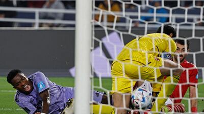 Real Madrid's Brazilian forward Vinicius Junior reacts after a challenge by Ahly's Egyptian defender Mahmoud Metwalli. AFP
