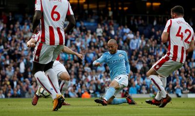 Manchester City's David Silva scores his side's third goal against Stoke. Andrew Yates / Reuters