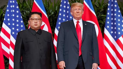 US President Donald Trump, right, stands with North Korean leader Kim Jong Un on Sentosa Island in Singapore. AP