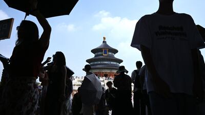 Tourists visit the Temple of Heaven in Beijing, China. AFP