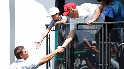 Bryson DeChambeau shakes hands with Mr Trump. Photo: USA TODAY Sports