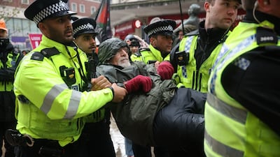 Police arrest a supporter of the banned Palestine Action group at a protest in Leeds. EPA