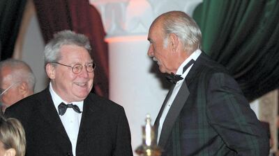 Sir Sean Connery, right, talks to Sir Alan Parker during the 44th International Film Festival in Marrakesh on December 7, 2004. AFP