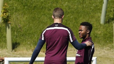 England's Raheem Sterling, right, and Jordan Henderson during training at St. George’s Park, in Burton Upon Trent on June 6, 2015. Reuters / John Sibley