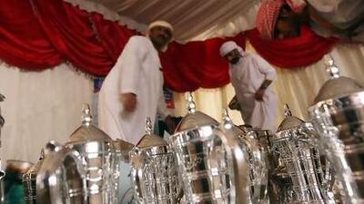 Coffee is brewed in large kettles and served to guests at a wedding.