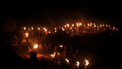 Palestinians take part in a protest against the new Israeli settler outpost.